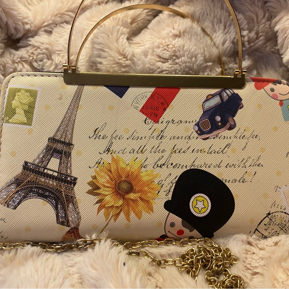 Chic Parisian Print Handbag with Gold Accents